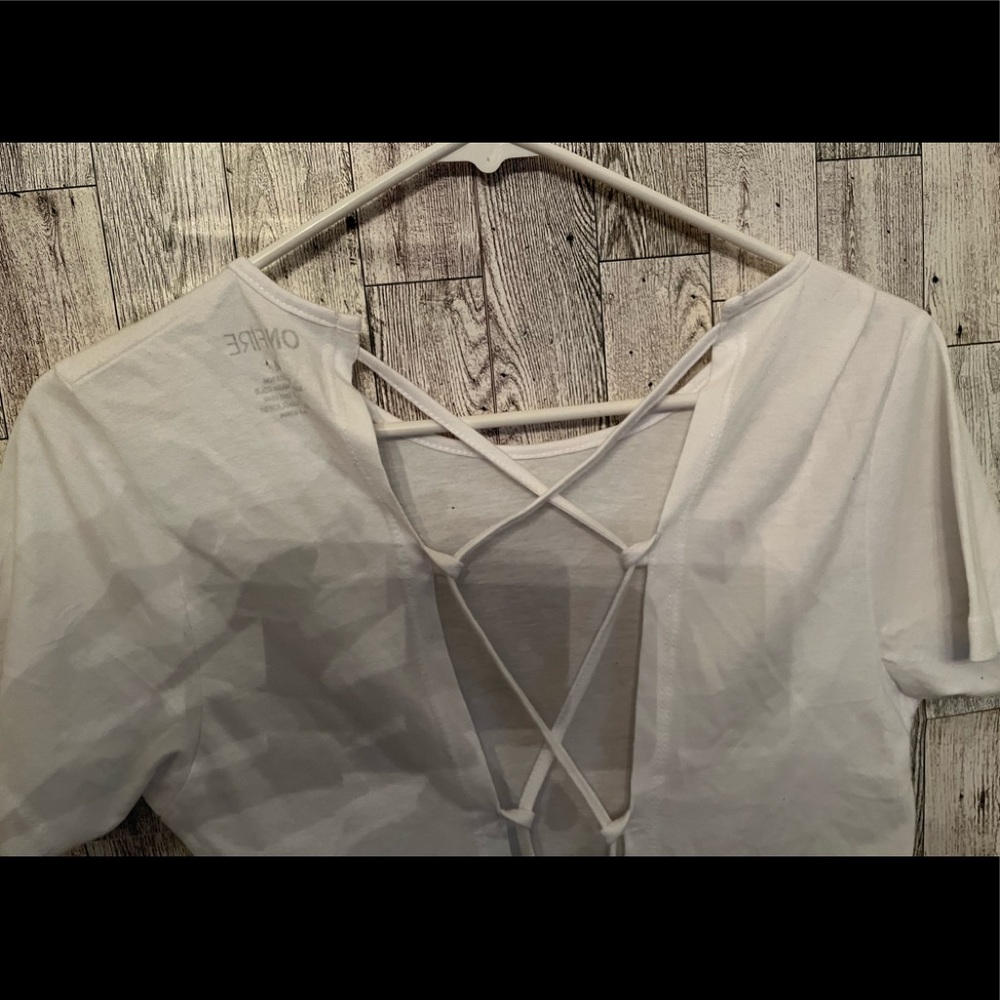White summer top open in the back - tie up shirt in back with attached strings.